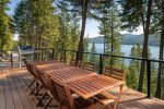 Dine al fresco in the fresh mountain air with incredible views of Whitefish Lake.